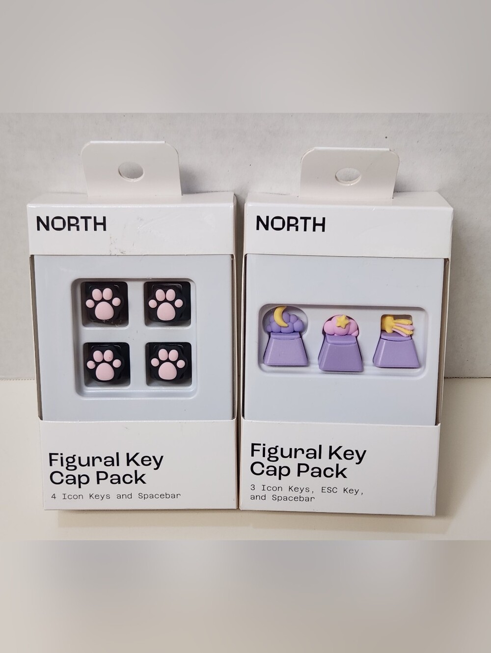 NORTH Figural Keycap Packs - Pink Paw & Purple Icon Sets
